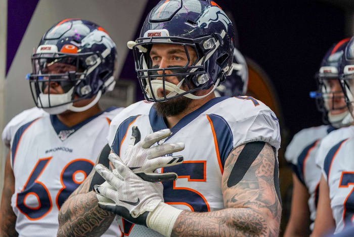 Derek Wolfe stands before a game in his Broncos uniform.